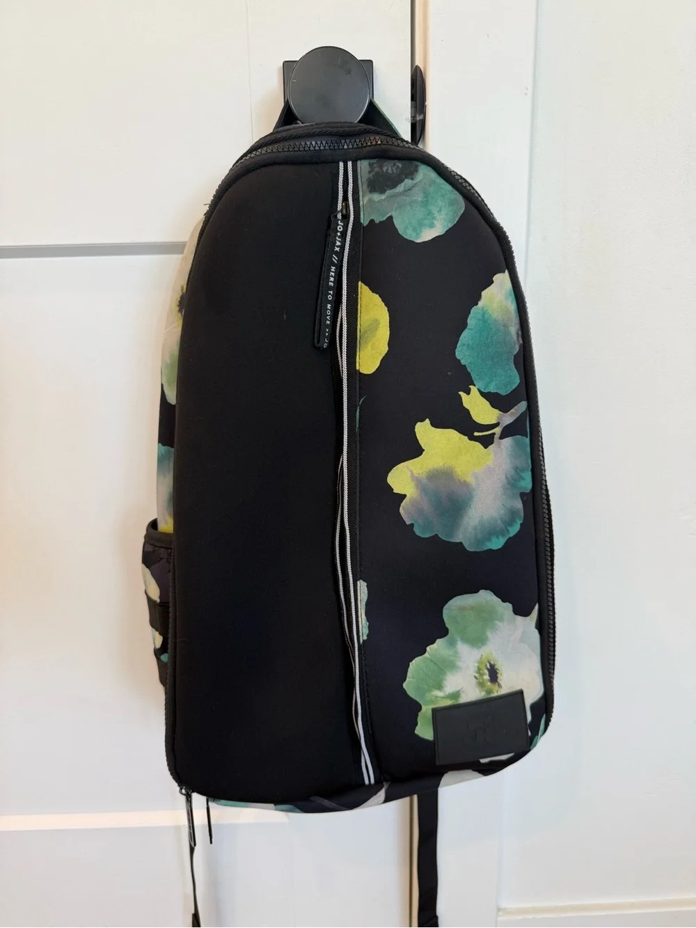 Women's Black Floral Sling Backpack with Green Accents